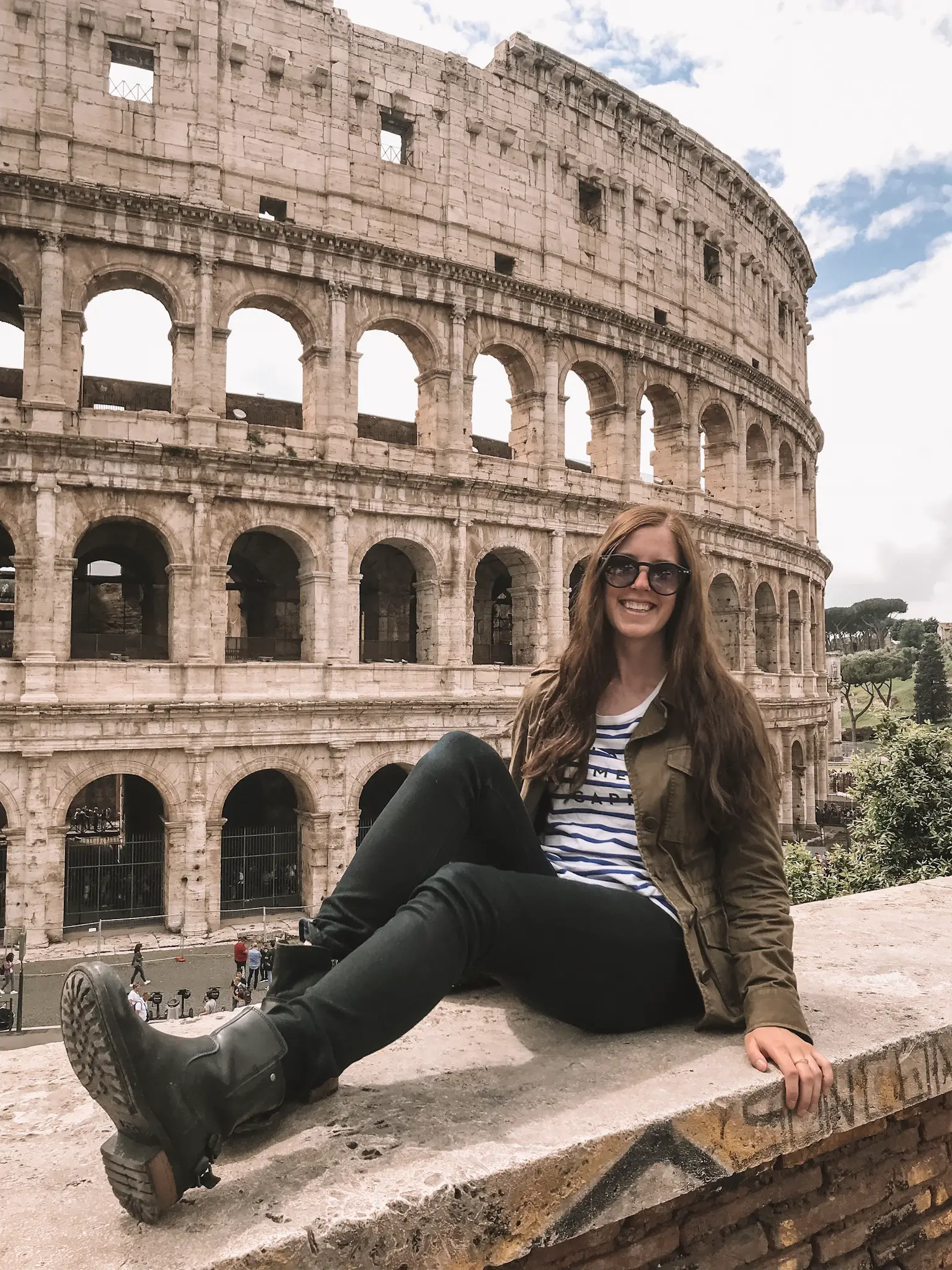 Girl in front of Colosseum in Rome Italy