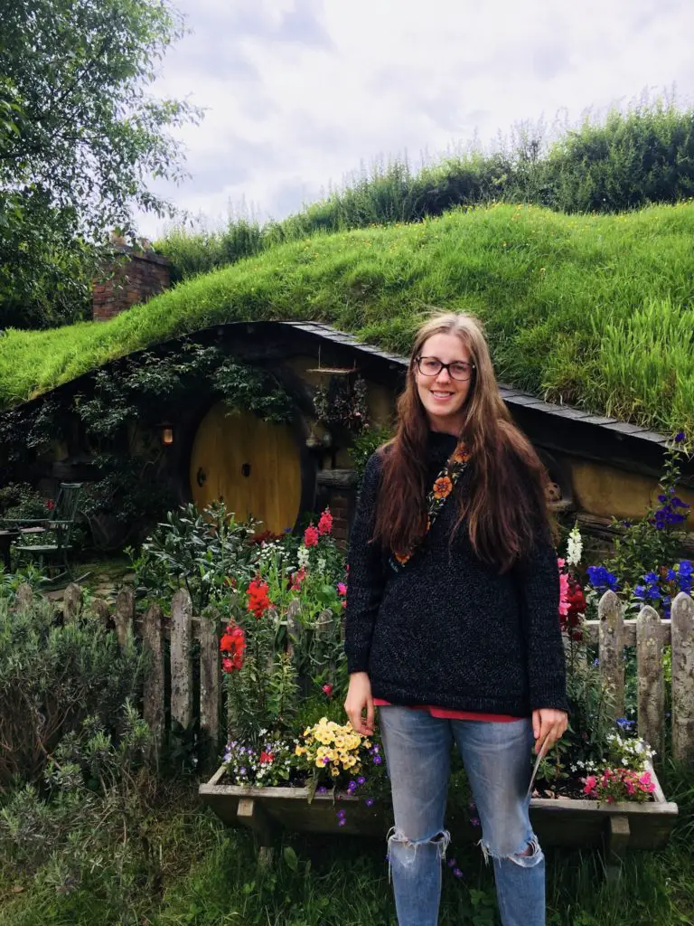 girl in front of Hobbit house