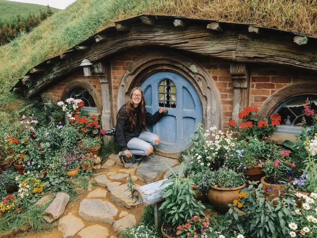 girl in front of Hobbit house