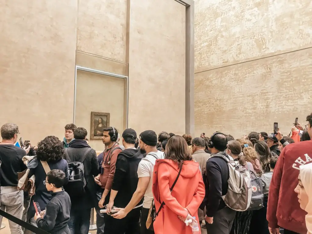 Crowds around Mona Lisa in Louvre in Paris
