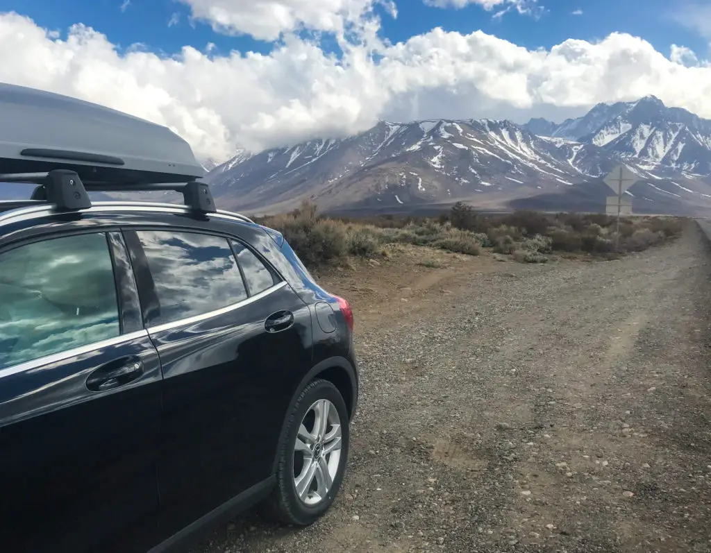 Car parked with mountain view in background